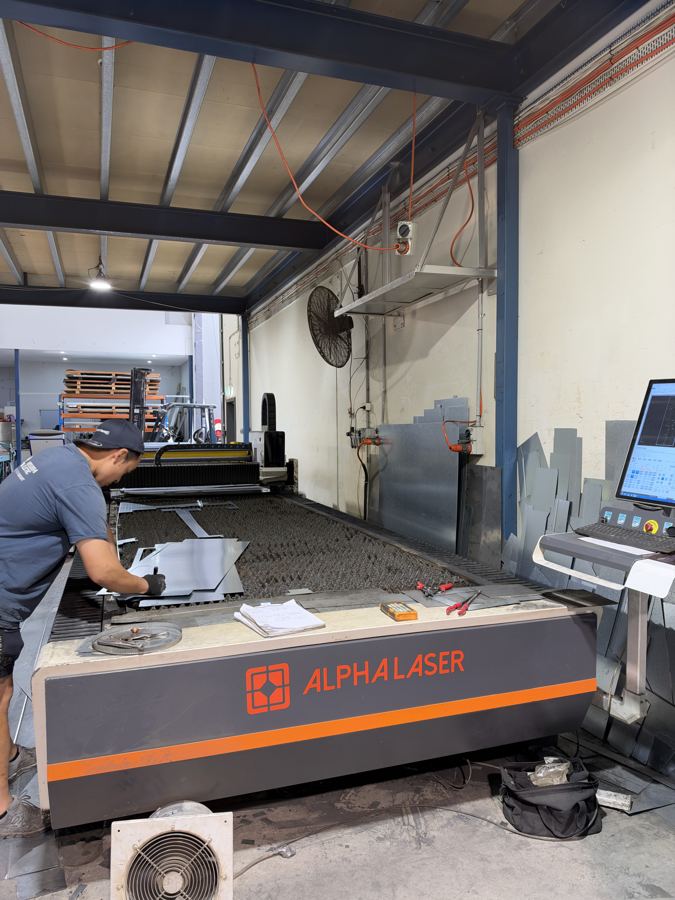 Laser cutting sheet metal in the factory